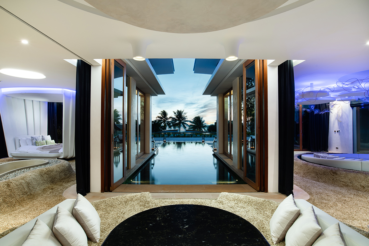 The view of a living area and outdoor private pool in a penthouse in Thailand